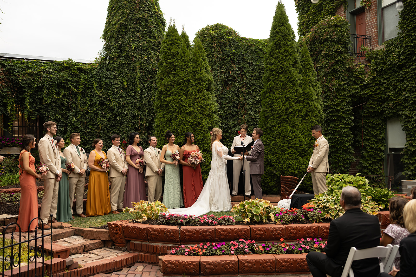 Brit & Tony's garden wedding ceremony at Lucile's in the Old Market in Omaha, photographed by Claire Katan.