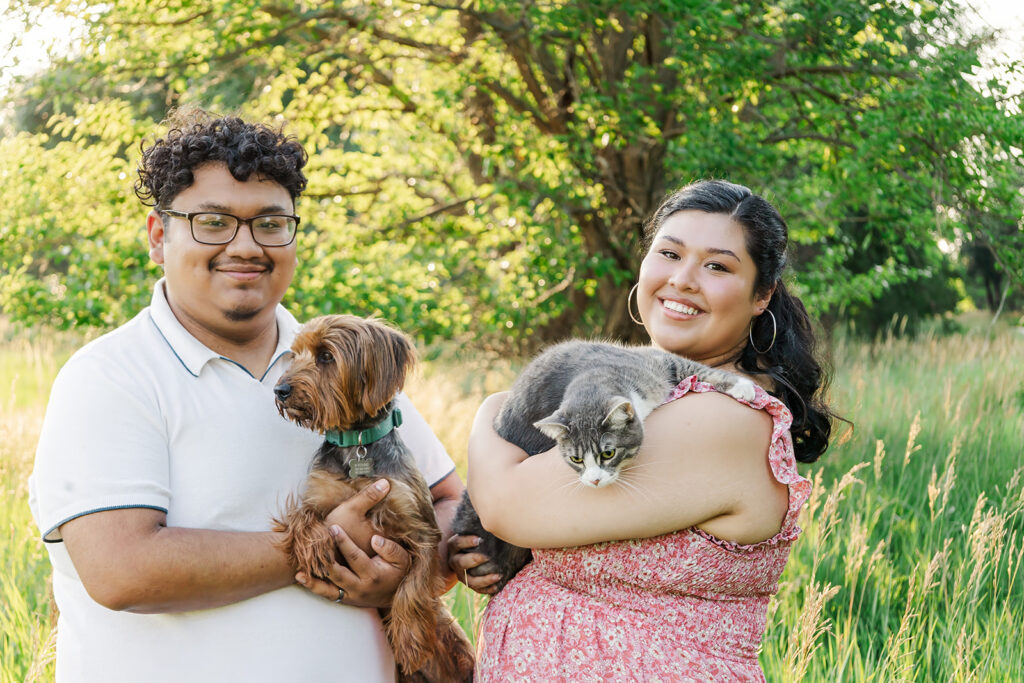 A spring pregnancy photo session at Chalco Hills Recreation area with expecting parents and their pets.