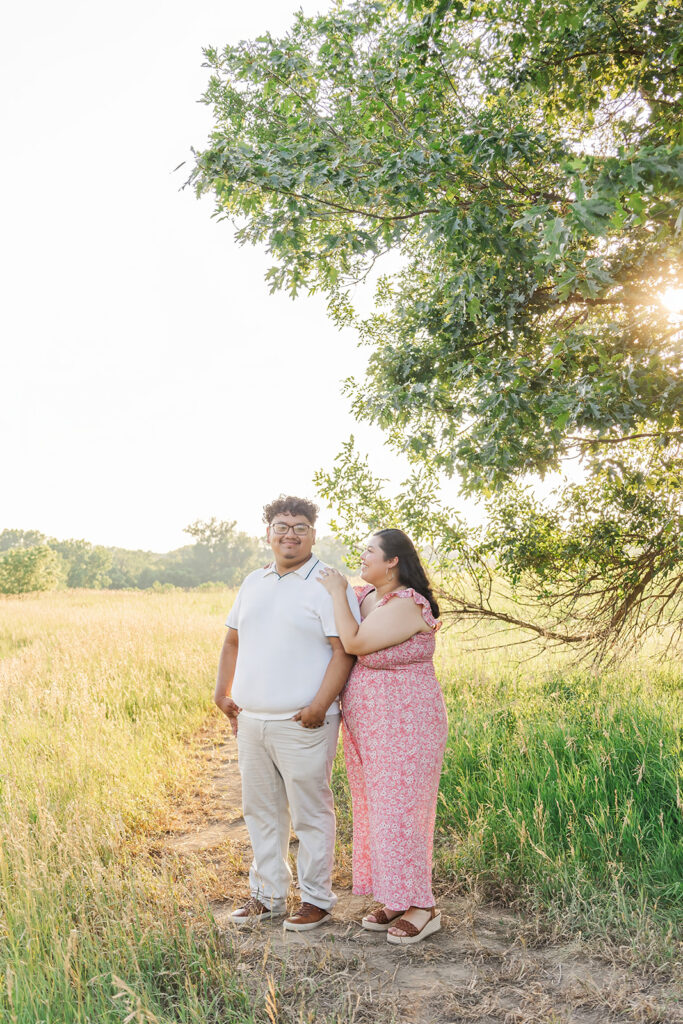 A spring pregnancy photo session at Chalco Hills Recreation area with expecting parents and their pets.