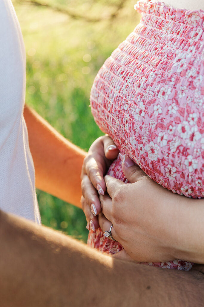 A spring pregnancy photo session at Chalco Hills Recreation area with expecting parents and their pets.
