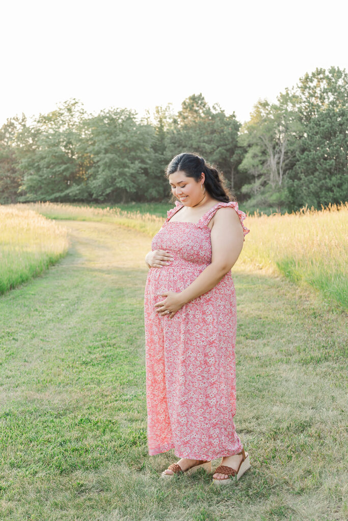 A spring pregnancy photo session at Chalco Hills Recreation area with expecting parents and their pets.