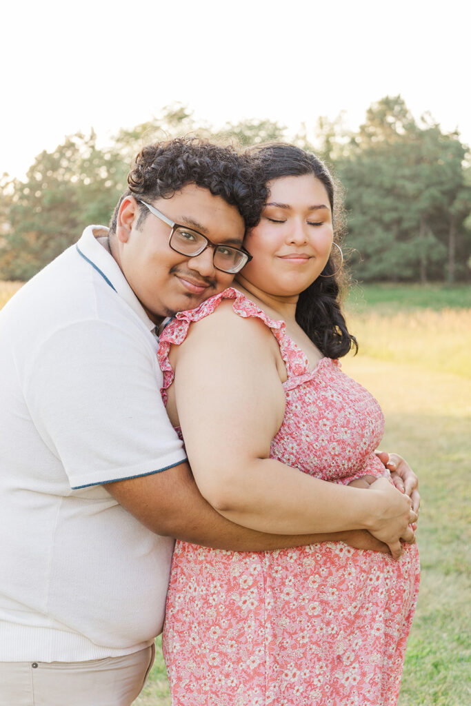 A spring pregnancy photo session at Chalco Hills Recreation area with expecting parents and their pets.