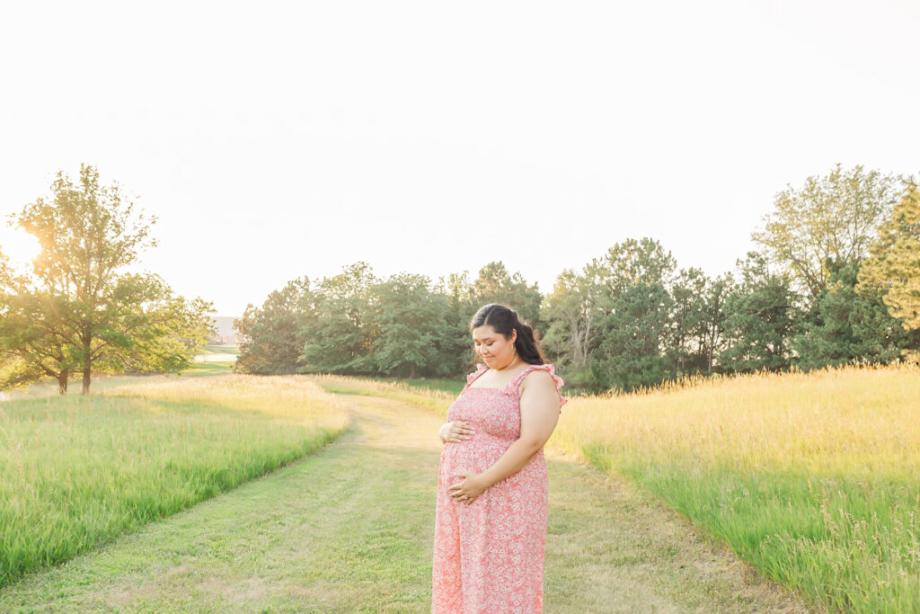 A spring pregnancy photo session at Chalco Hills Recreation area with expecting parents and their pets.