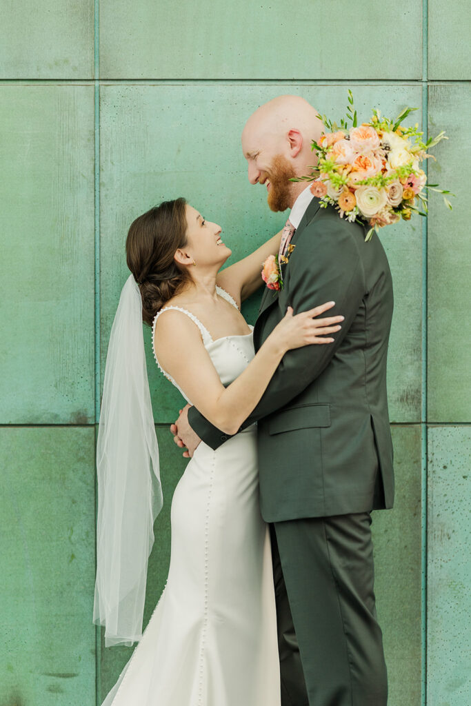 A modern, romantic wedding in downtown Omaha with a ceremony at the Holland Performing Arts Center and a reception at the Leo Ballroom.