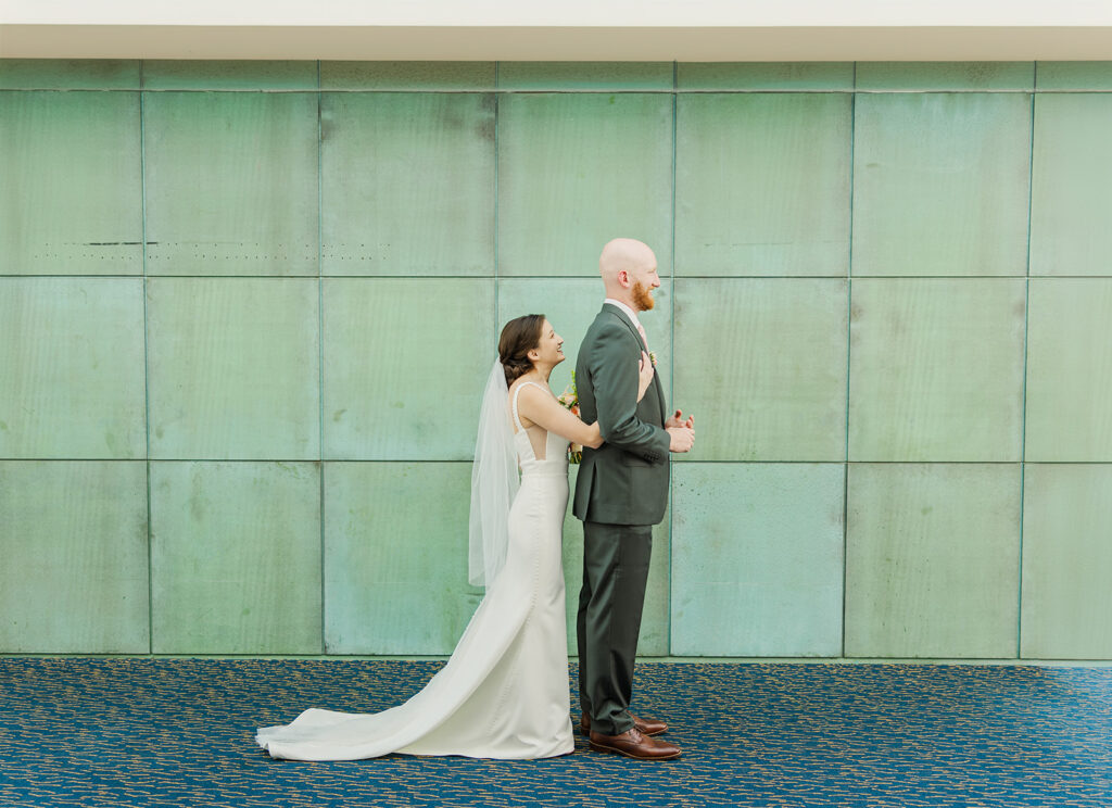 A modern, romantic wedding in downtown Omaha with a ceremony at the Holland Performing Arts Center and a reception at the Leo Ballroom.