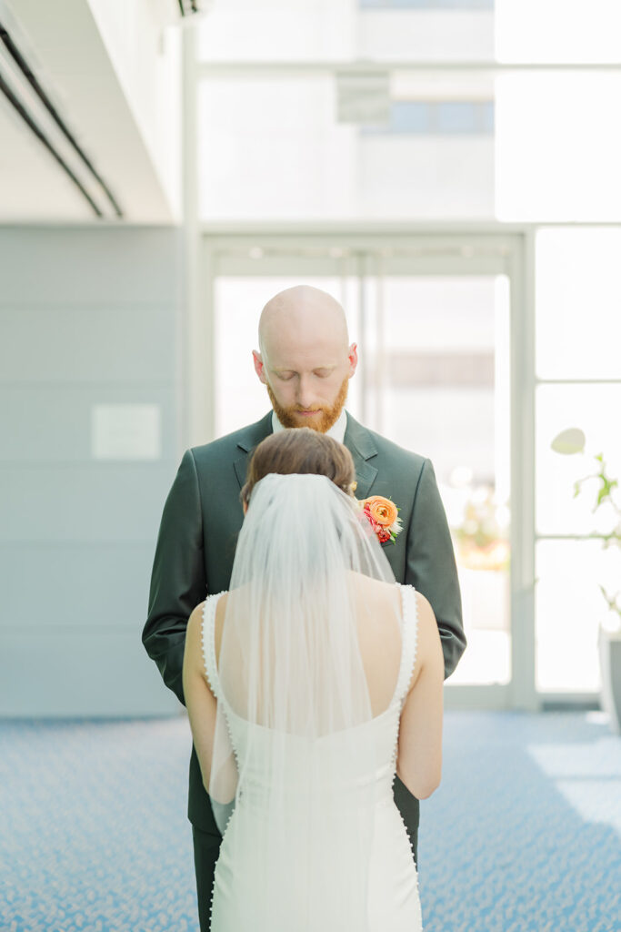 A modern, romantic wedding in downtown Omaha with a ceremony at the Holland Performing Arts Center and a reception at the Leo Ballroom.