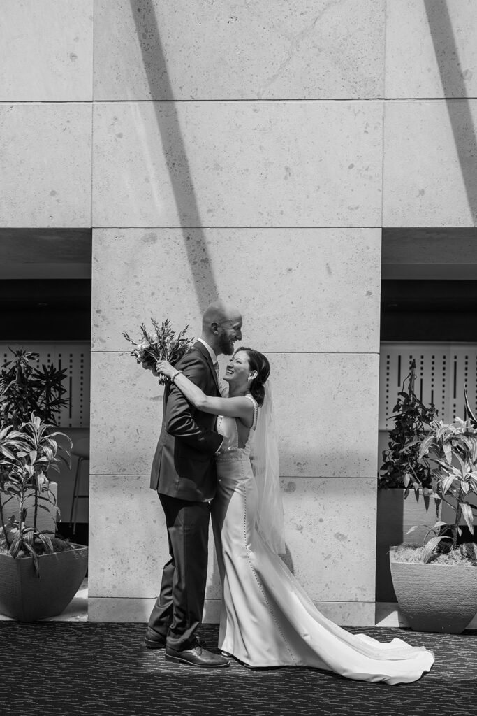 A modern, romantic wedding in downtown Omaha with a ceremony at the Holland Performing Arts Center and a reception at the Leo Ballroom.