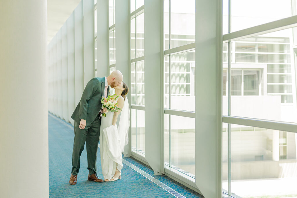 A modern, romantic wedding in downtown Omaha with a ceremony at the Holland Performing Arts Center and a reception at the Leo Ballroom.