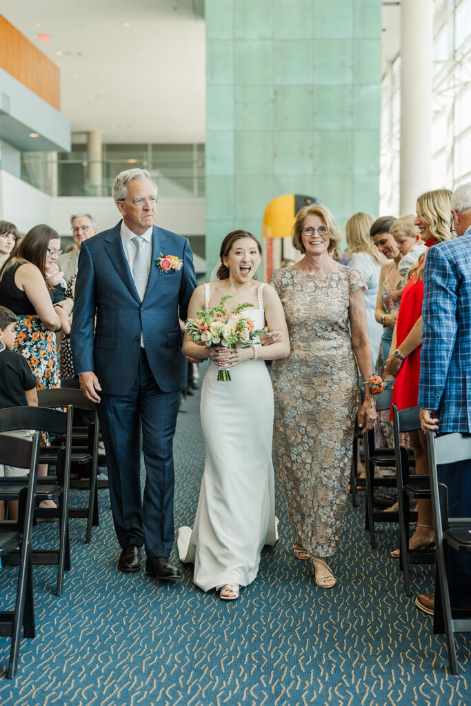 A modern, romantic wedding in downtown Omaha with a ceremony at the Holland Performing Arts Center and a reception at the Leo Ballroom.