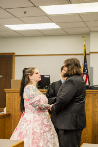 Jay and Evie's Fall Courthouse Wedding Elopement at the Council Bluffs Courthouse with wedding portraits at Omaha's Lauritzen Gardens and Chalco Hills Recreation Area, photographed by Claire Katan Creative.