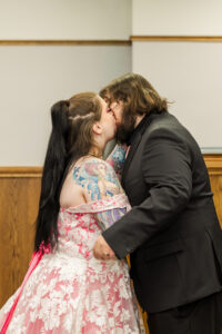 Jay and Evie's Fall Courthouse Wedding Elopement at the Council Bluffs Courthouse with wedding portraits at Omaha's Lauritzen Gardens and Chalco Hills Recreation Area, photographed by Claire Katan Creative.