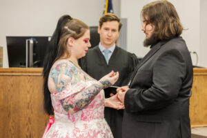 Jay and Evie's Fall Courthouse Wedding Elopement at the Council Bluffs Courthouse with wedding portraits at Omaha's Lauritzen Gardens and Chalco Hills Recreation Area, photographed by Claire Katan Creative.