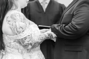 Jay and Evie's Fall Courthouse Wedding Elopement at the Council Bluffs Courthouse with wedding portraits at Omaha's Lauritzen Gardens and Chalco Hills Recreation Area, photographed by Claire Katan Creative.