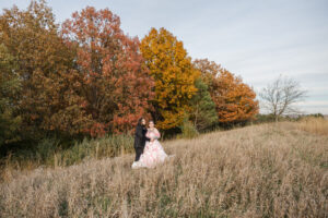 Jay and Evie's Fall Courthouse Wedding Elopement at the Council Bluffs Courthouse with wedding portraits at Omaha's Lauritzen Gardens and Chalco Hills Recreation Area, photographed by Claire Katan Creative.