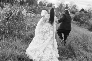 Jay and Evie's Fall Courthouse Wedding Elopement at the Council Bluffs Courthouse with wedding portraits at Omaha's Lauritzen Gardens and Chalco Hills Recreation Area, photographed by Claire Katan Creative.