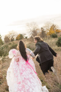 Jay and Evie's Fall Courthouse Wedding Elopement at the Council Bluffs Courthouse with wedding portraits at Omaha's Lauritzen Gardens and Chalco Hills Recreation Area, photographed by Claire Katan Creative.