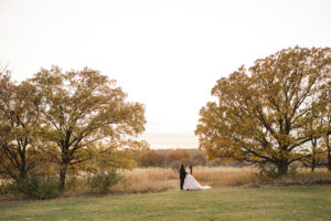Jay and Evie's Fall Courthouse Wedding Elopement at the Council Bluffs Courthouse with wedding portraits at Omaha's Lauritzen Gardens and Chalco Hills Recreation Area, photographed by Claire Katan Creative.