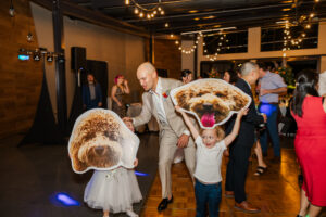 Michelle and Devin's Luxury Wedding at the Omaha Henry Doorly Zoo's Harper Event Center photographed by Claire Katan Creative
