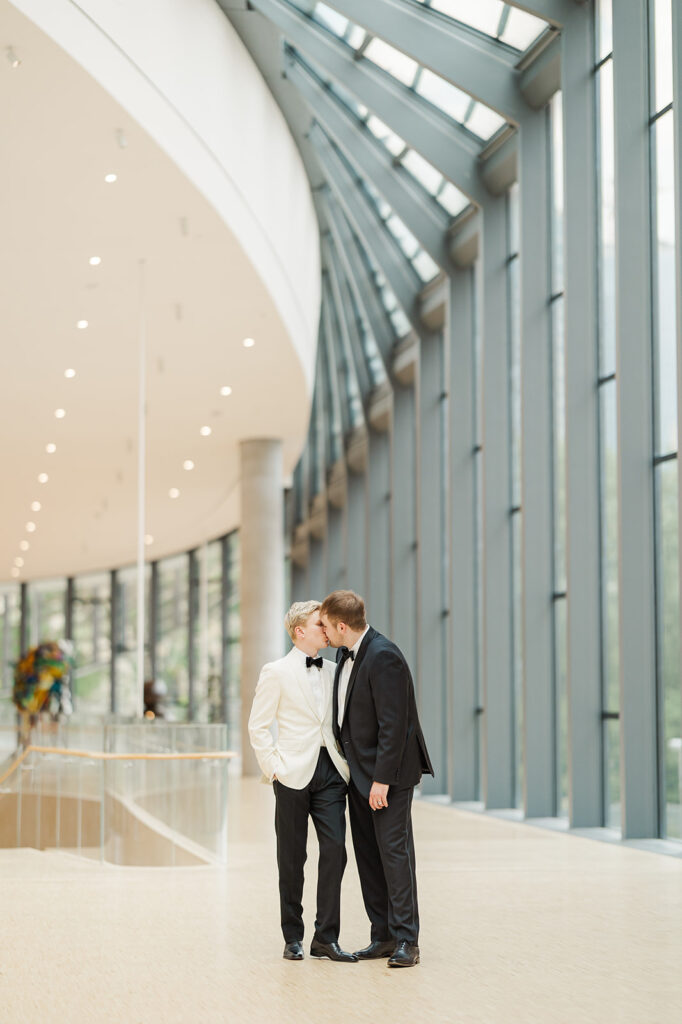 Two grooms getting married at Joslyn Art Museum in Omaha, NE.
